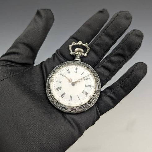 Antique Swiss made unsigned pocket watch with embossed silver plate case works well